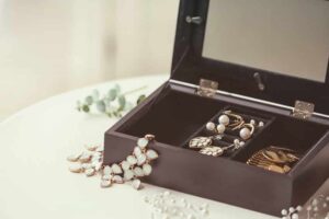 Collection of bijouterie in jewelry box on table